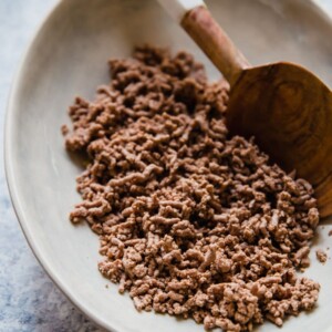 Wondering how to cook ground beef? Frying is a popular option, but boiling ground beef is easy, quick, and it creates leaner meat! Cooking ground beef with this method creates the perfect crumbled ground beef for tacos, chili, spaghetti sauce, and more.