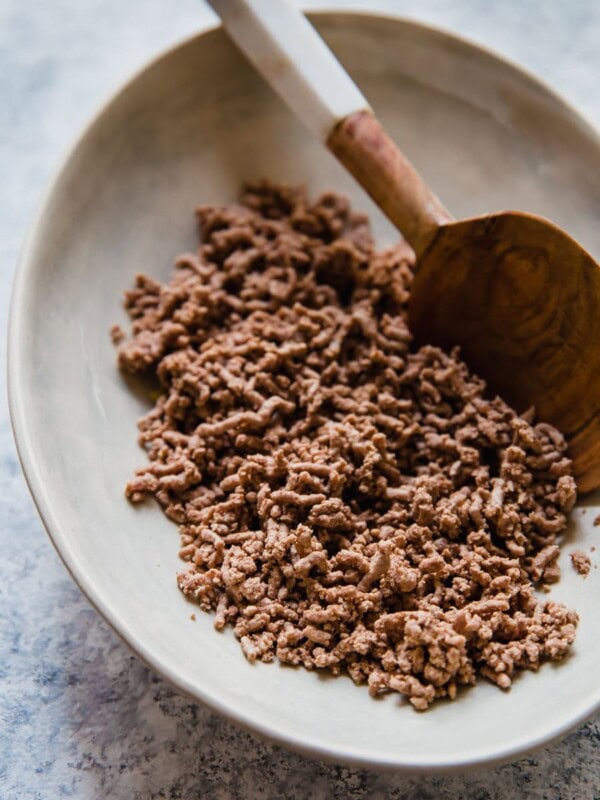 Wondering how to cook ground beef? Frying is a popular option, but boiling ground beef is easy, quick, and it creates leaner meat! Cooking ground beef with this method creates the perfect crumbled ground beef for tacos, chili, spaghetti sauce, and more.