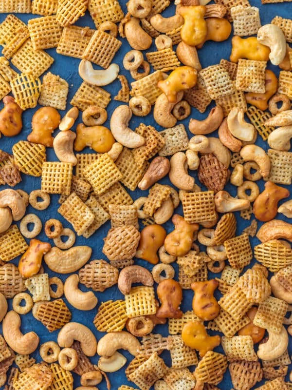 Chex Mix Recipe is a recipe my Mom has been making since I was a little kid. It's our family's favorite BEST Chex Party Mix! It doesn't get better than this mix of cereal, nuts, pretzels, and all that spice! A little bit sweet and little bit spicy. This BEST EVER Chex Party Mix Recipe is perfect for Christmas, tailgating, Summer BBQs, and every day in between. SO ADDICTING!