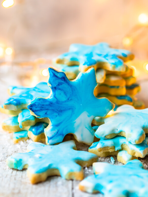 Christmas Butter Cookies with Powdered Sugar Icing are a MUST for the holidays. Simple iced cookies are one of the best treats for Christmas, and this easy butter cookies recipe is my FAVORITE. Make your favorite shapes with cookie cutters, and decorate however you like using our powdered sugar icing recipe!