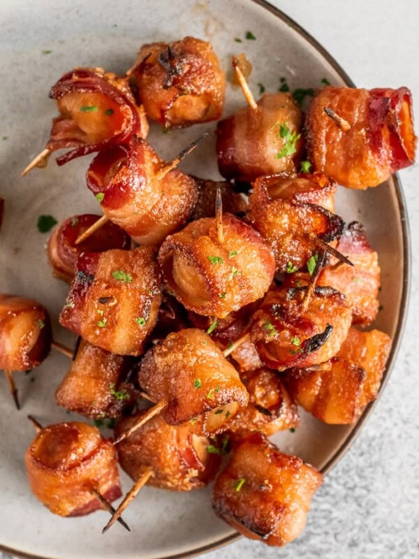 Bacon Wrapped Water Chestnuts are a simple and delicious appetizer for game day or any party. The soy-soaked water chestnuts are crunchy and flavorful, and once you add the bacon...yum! You can't go wrong with bacon wrapped appetizers. Try this bacon wrapped water chestnuts recipe right away!