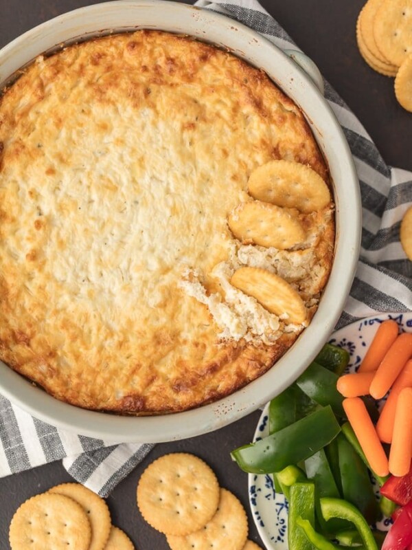 HOT ONION DIP has been a family favorite for years. I just love the sweet, cheesy onion flavor. You really can't do better than a classic hot onion dip recipe for the holidays or game day. It's perfect for dipping and oh so yummy. This is the BEST hot onion souffle dip recipe around!