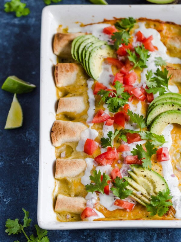 Honey Lime Chicken Enchiladas are a little bit sweet, a little bit spicy, and a whole lot of yummy! The chicken is marinated in a delicious honey lime mix, making the perfect base for these enchiladas. This easy chicken enchilada recipe is cheesy, flavorful, and fun. Try them out for your next dinner!