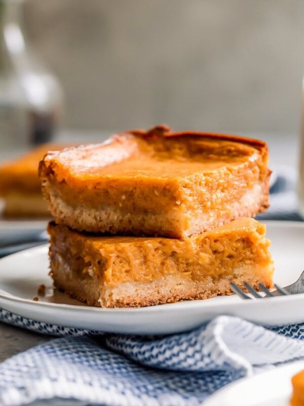 Pumpkin Gooey Butter Cake is a fall dessert recipe, but I like to make (and eat!) this ooey gooey cake year-round! If you don't know what gooey butter cake is, then you NEED to make this recipe ASAP. The combination of pumpkin and the gooey butter cake will blow your mind!