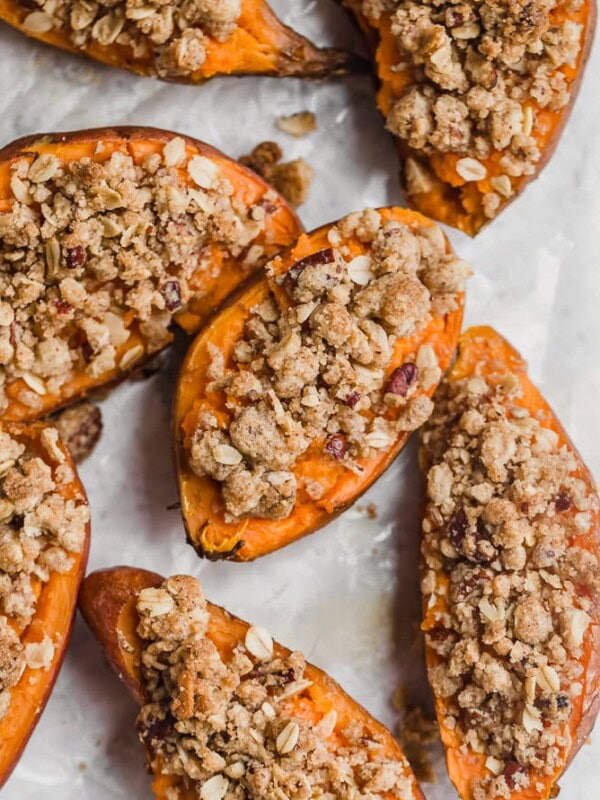 Twice Baked Sweet Potatoes are the perfect Thanksgiving sweet potato recipe! They're just like a regular twice baked potato, but they're topped with a pecan, cinnamon, oatmeal, and brown sugar mix to complement the natural sweetness. You'll definitely want this tasty sweet potato side dish on your holiday table!