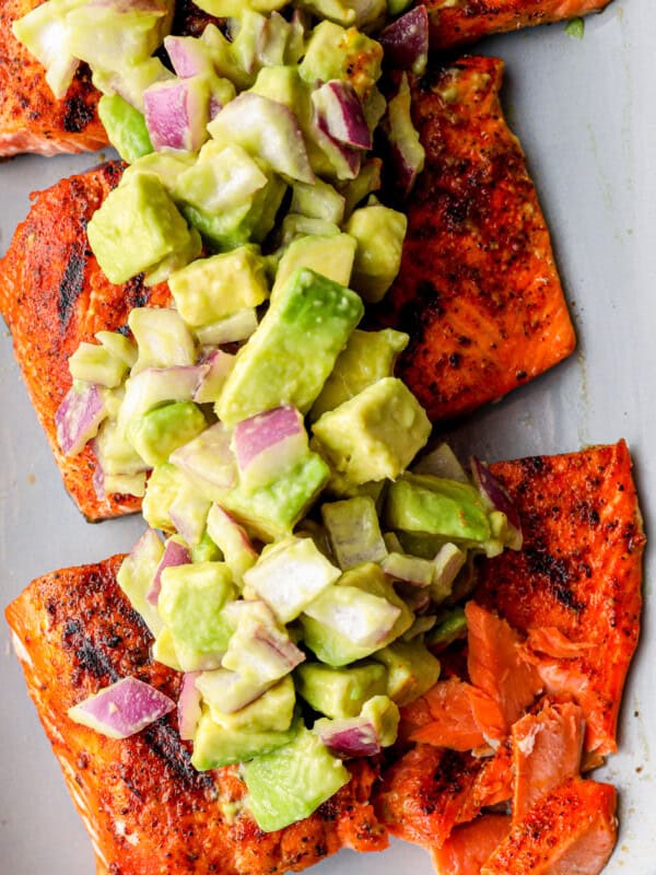 platter of grilled salmon with avocado salsa