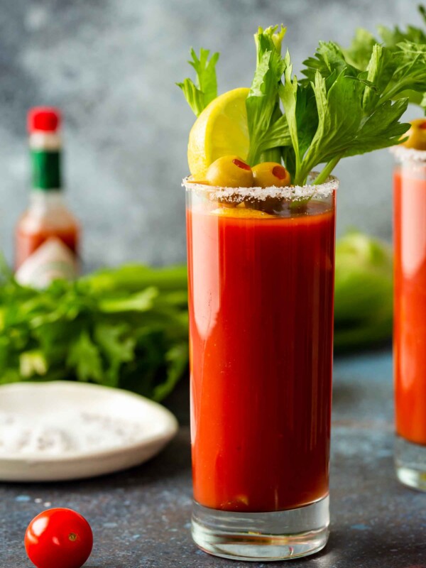 bloody mary in a tall glass with garnishes