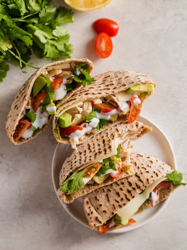 Chicken Pita Sandwiches are a healthy and delicious lunch option. This Chicken Avocado Sandwich is perfect for work days. Easy to make and so much flavor! These Chicken Avocado Pita Pockets prove that healthy lunches don't have to taste boring.