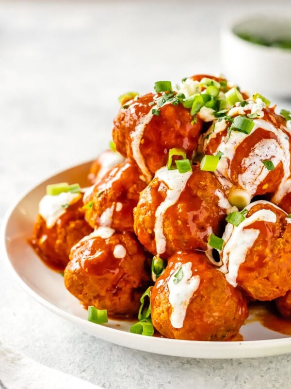 Buffalo Chicken Meatballs are one of our very favorite party appetizers. These Blue Cheese Stuffed Meatballs are relatively healthy, SO flavorful, and sure to please. If you're not sure what to serve for your next tailgating party, this Buffalo Chicken Meatballs Recipe is just the thing. Serve with Homemade Ranch!