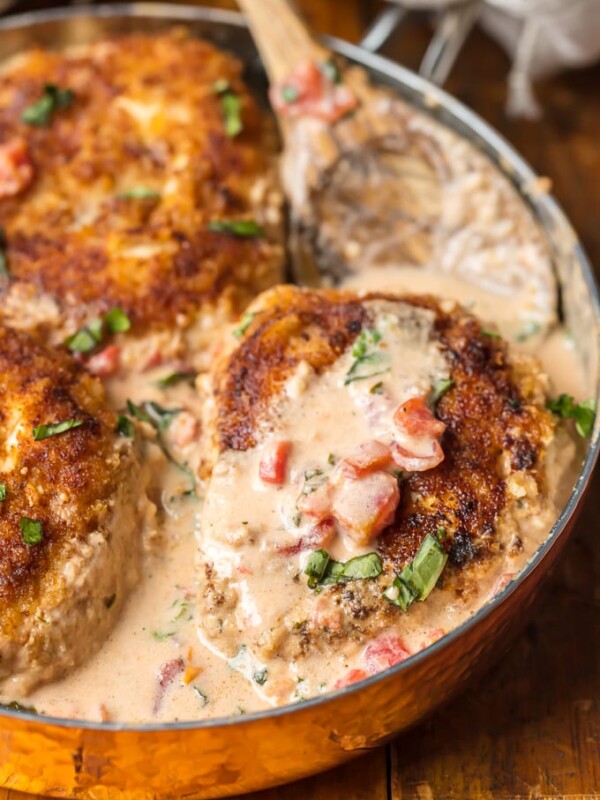 Basil Chicken with Cream Sauce has always been one of my favorite recipes. This Basil Chicken Recipe has a creamy sauce made with buttermilk and cheese that is just to die for. Easy breaded chicken, tomatoes, fresh herbs, and more make up this super easy, delicious, and fool-proof Skillet Chicken Recipe. You need this Cream Chicken in your life ASAP!