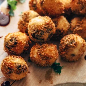 Fried Goat Cheese Balls are the perfect New Year's Eve appetizer! These goat cheese poppers are stuffed with dried cherries and pecans and then deep fried into a crispy little snack. It's definitely my favorite goat cheese appetizer!