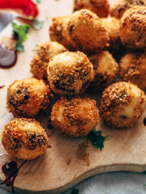 Fried Goat Cheese Balls are the perfect New Year's Eve appetizer! These goat cheese poppers are stuffed with dried cherries and pecans and then deep fried into a crispy little snack. It's definitely my favorite goat cheese appetizer!