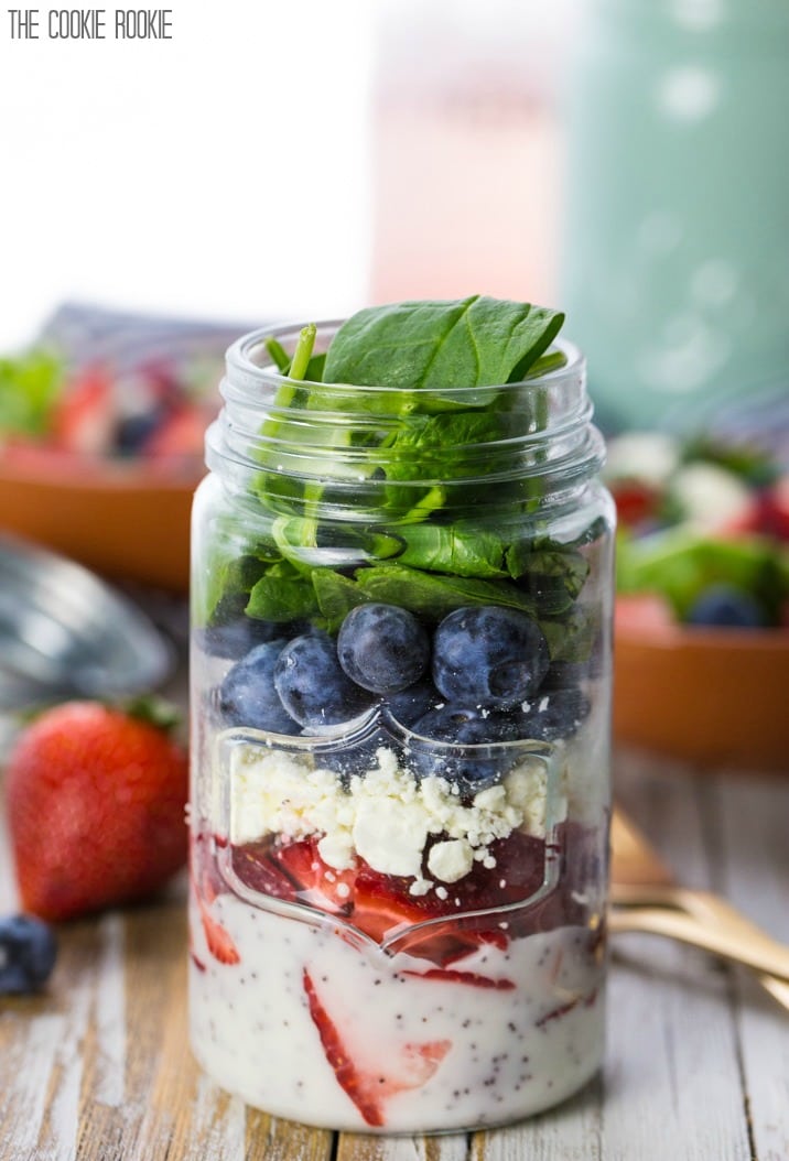 Red White and Blue Mason Jar Salad! So cute and easy. Perfect for Memorial Day and Fourth of July! Strawberry and Blueberry Salad with Feta. Yum.