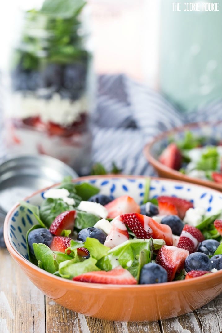 Red White and Blue Mason Jar Salad! So cute and easy. Perfect for Memorial Day and Fourth of July! Strawberry and Blueberry Salad with Feta. Yum.