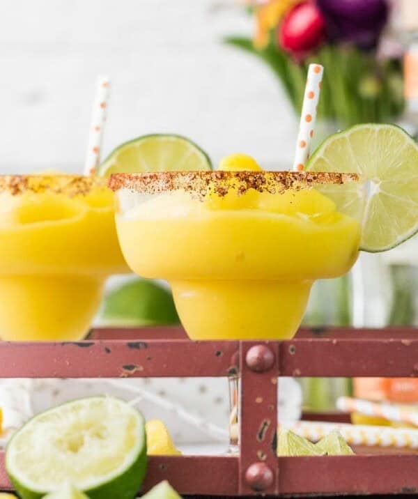 margaritas garnished with lime