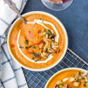 Vegan Pumpkin Soup with Candied Cashews...a healthy and delicious Fall favorite made in minutes! SO MUCH FLAVOR! Made with cashew milk and topped with spicy sweet cashews. Perfect recipe for Thanksgiving and Christmas!