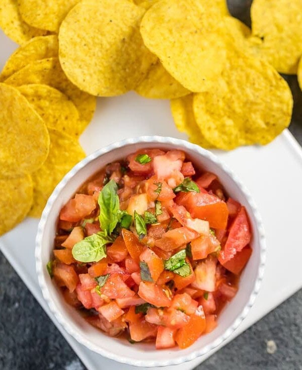 This EASY Italian Salsa only has 5 ingredients! Love these flavors as a dip or bruschetta topper. Simple to throw together and gone in minutes! Favorite easy salsa recipe!