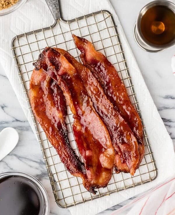 Oven Baked Candied Whiskey Bacon is the BEST bacon recipe for breakfast, sandwiches, salads, and everything in between! Baked in the oven! BEST BACON EVER!