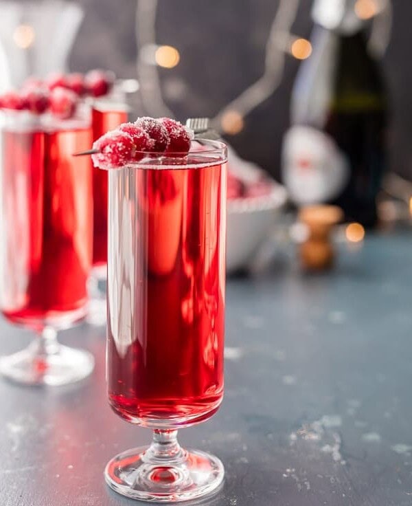 Sugared Cranberry Ginger Mimosas, ONLY THREE INGREDIENTS! Easy holiday cocktail recipe perfect for Thanksgiving, Christmas, and Valentine's Day! Pretty Red Cocktail!