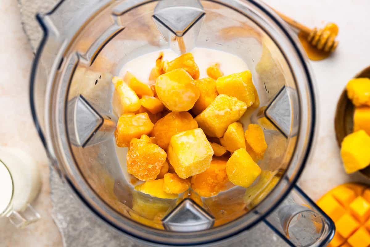 mango chunks and milk in a blender.