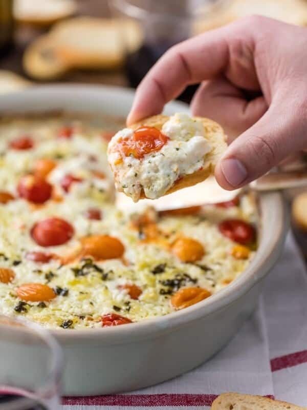 Garlic Herb Tomato Goat Cheese Dip is my FAVORITE EASY CHEESE DIP APPETIZER! Baked Goat Cheese Dip is classy, simple, and so delicious. Packed with tomatoes, garlic, feta, ricotta, and goat cheese. Go-to baked cheese appetizer.