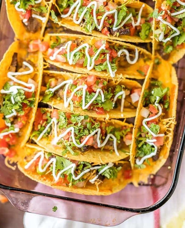 Baked Steak and Eggs Breakfast Tacos are perfect for a crowd! Baked Tacos are super easy, melty, cheesy, and delicious! Just the right amount of spice. A FAMILY FAVORITE!