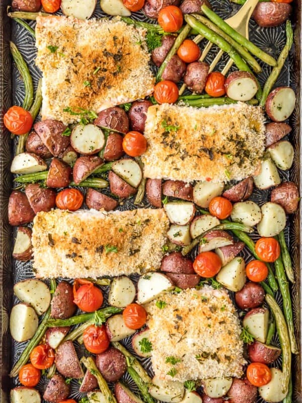 Sheet Pan Honey Mustard Crusted Salmon is the perfect healthy one pan meal! Made in under 30 minutes, skinny, and full of flavor. Oven baked salmon on a baking sheet with potatoes, tomatoes, and green beans!