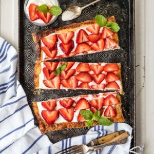 sliced strawberry tart on plate