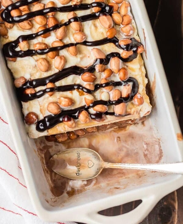 Be the hero of any party with this LAZY GIRL'S SNICKERS ICE CREAM CAKE! Made with pound cake, chocolate and vanilla ice cream, caramel, and peanuts. BEST EASY ICE CREAM CAKE EVER!