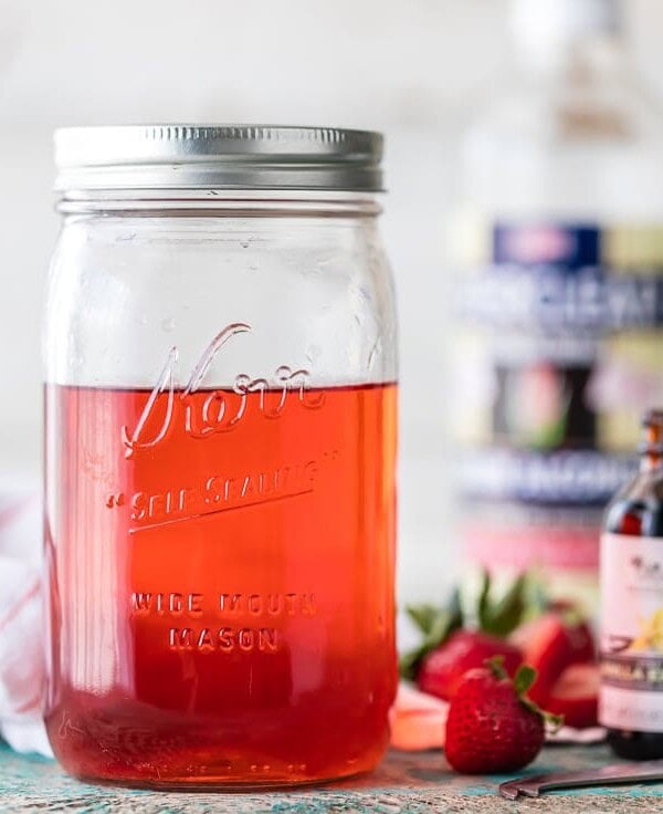 You can make HOMEMADE STRAWBERRY SHORTCAKE VODKA at home! SO easy and tastes amazing! Perfect with SPIKED STRAWBERRY SHORTCAKE ICE CREAM FLOATS! The ultimate Summer treat.