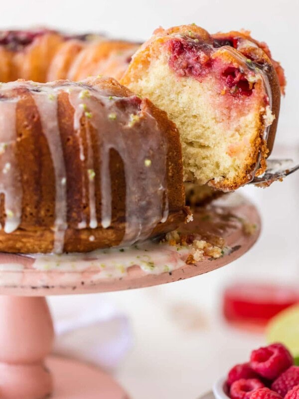 RASPBERRY CAKE makes life a little bit sweeter! This cake is inspired by one of my fave drinks, the Moscow Mule. It's made with fresh raspberries, ginger beer, a raspberry moscow mule simple syrup, and a fresh lime glaze.