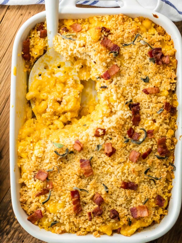 Baked Pumpkin Bacon Mac and Cheese is the ULTIMATE comfort food for Fall! Autumn in a casserole dish! Loaded with cheese, bacon, pumpkin, sage, and more cheese. BEST MACARONI AND CHEESE EVER!