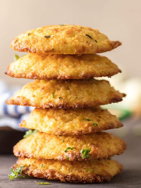 Cheesy Cornbread Drop Biscuits are EASY, delicious, and perfect for the holidays! These delicious garlic and cheese cornbread biscuits always make an appearance on our Thanksgiving and Christmas tables. This easy cornbread recipe can be made in no time with the help of cornbread mix and a few extra ingredients!