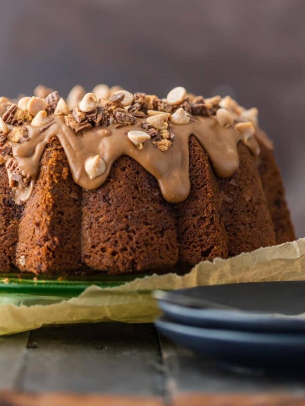 CHOCOLATE PEANUT BUTTER CUP POUND CAKE is the ultimate bundt cake recipe! Topped with a decadent peanut butter icing, this indulgent cake is perfect for the holidays!