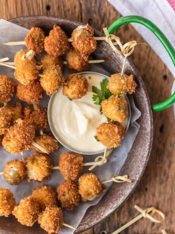 These FRIED BLUE CHEESE STUFFED OLIVES are just delicious. And when served with a simple garlic aioli sauce, they are absolutely addicting! These fried and stuffed olives are the perfect holiday appetizer, just what you need for Christmas or New Year's Eve!