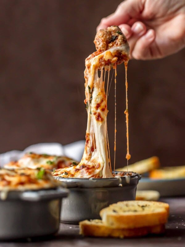 Parmesan Meatball Soup is the ultimate comfort food! This cheesy, hearty Meatball Parmesan Soup topped with melted cheese and basil just might be the best soup you've had all year!