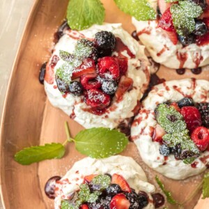 overhead shot of mini pavlovas on a gold platter