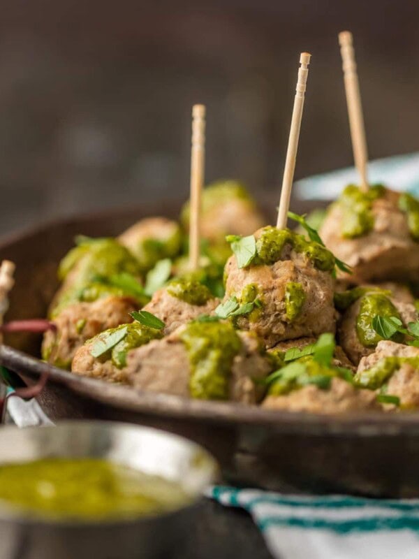 These PERUVIAN CHICKEN MEATBALLS WITH GREEN SAUCE are the perfect holiday or Super Bowl appetizer! The Peruvian green sauce, made with a parsley base, is just the right amount of spicy. The drop meatballs are just the right amount of easy.