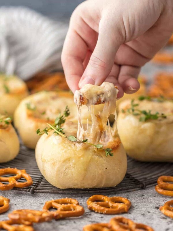 FRENCH ONION DIP is a classic appetizer that should be present at every party. We made this dip even more fun by making it in mini bread bowls! Making bread bowls with fresh rolls is easy, and it makes the perfect appetizer for the Super Bowl.