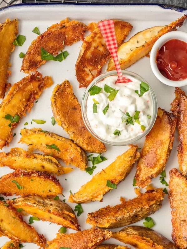 These CRISPY PARMESAN POTATO WEDGES are so absolutely delicious and EASY! You'll never go back to regular fries after you try these thick potato wedges coated in a crispy cheese shell. Just too good!