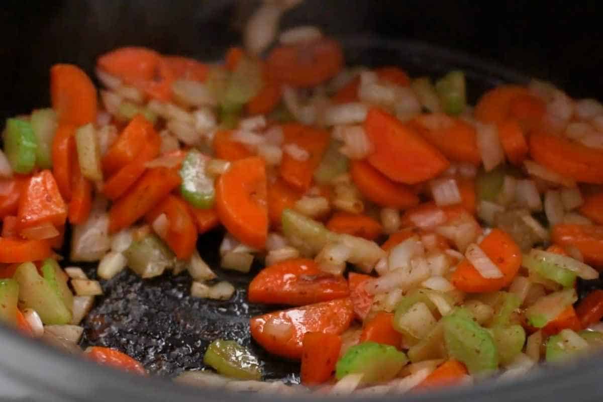 added onion and celery and stirring with the help of spatula.