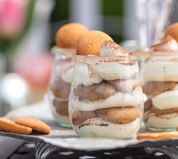 These Easy Tiramisu Cups are made with a secret ingredient, vanilla wafers! This easy tiramisu recipe is perfect for summer parties & BBQs. Easy to make, easy to serve, and easy to eat!