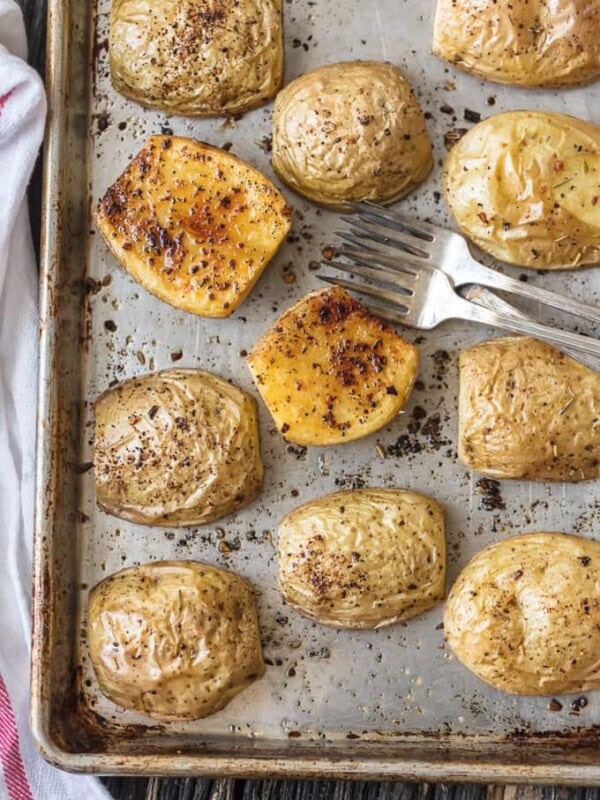 a pan of roasted potatoes with forks