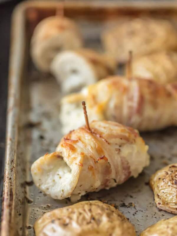 These CHEESY PANCETTA WRAPPED CHICKEN ROLLUPS are so quick and easy and delicious! Chicken stuffed with boursin cheese and wrapped in pancetta makes for the most moist and delicious chicken ever.