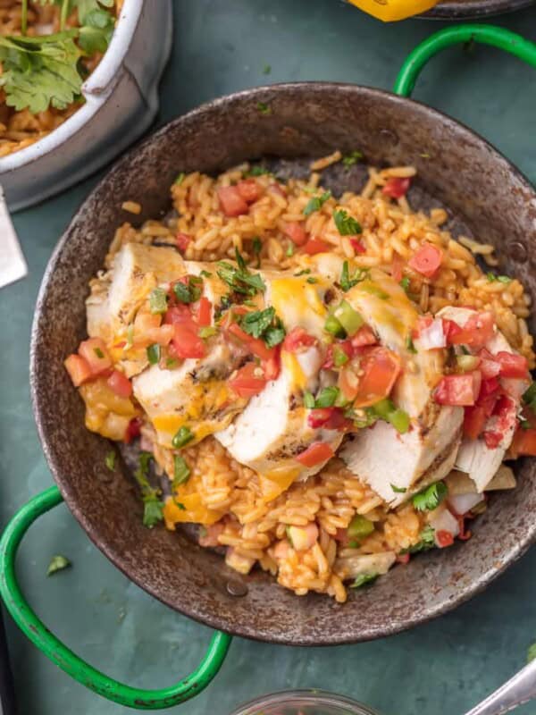 FIESTA LIME CHICKEN is our favorite easy grilled Summer meal! Served on a bed of Mexican rice and topped with lime ranch, pico de gallo, and tortilla strips; this flavor can't be beat!