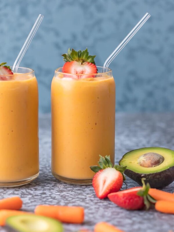 This Coconut Water Smoothie is full of delicious ingredients like coconut water, strawberries, mangoes, carrots, and avocado! Sip your way to beautiful skin with this healthy smoothie recipe!