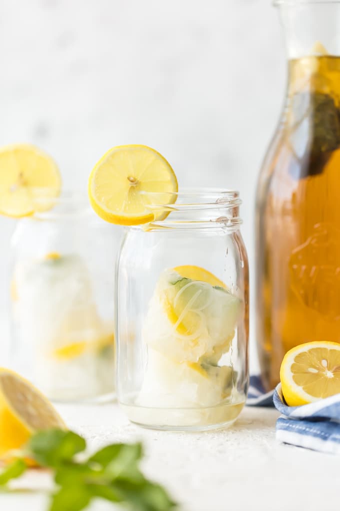 Lemon simple syrup ice cubes in mason jars