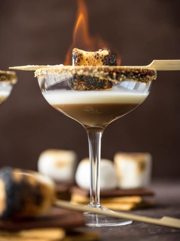 toasted smores martinis with a marshmallow on fire