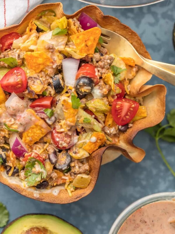 TACO SALAD is one of my favorite weeknight meals. It's simple, fresh, and easy to make. Taco Bowls are like a healthy version of my favorite Mexican dishes! We just love these CREAMY TACO SALAD BOWLS any night of the week. With a homemade tortilla bowl and loaded with all the toppings, this recipe can't be beat.