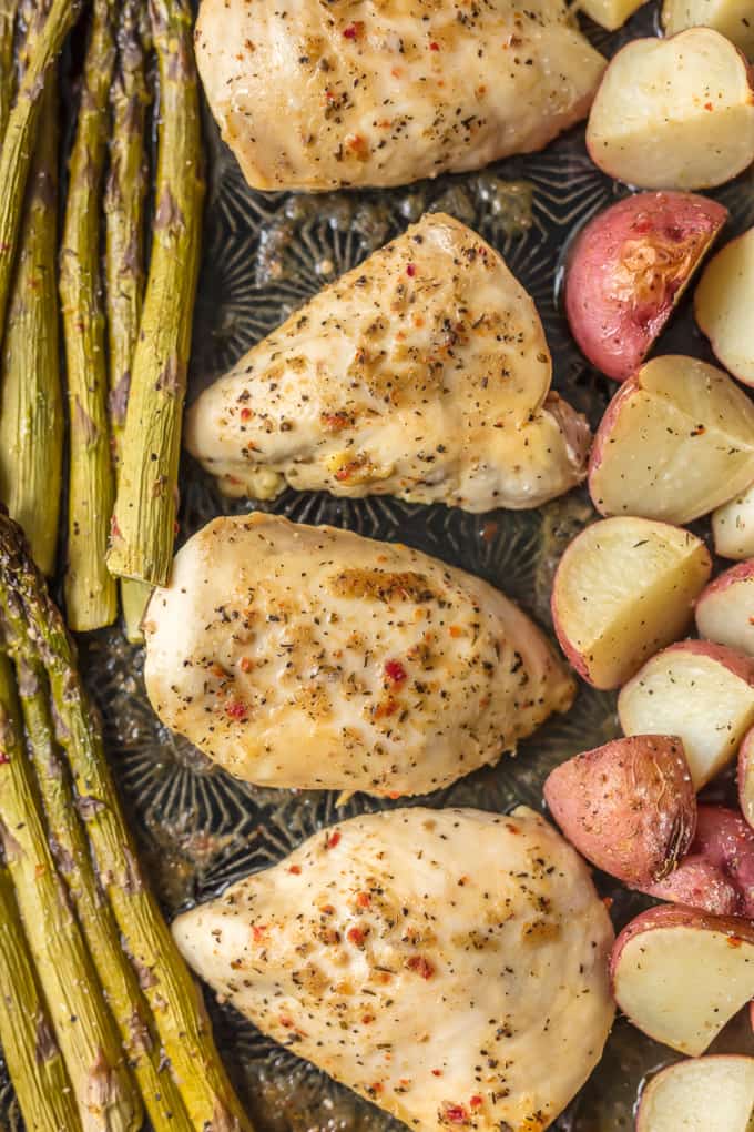 This ONE PAN HONEY GARLIC CHICKEN AND VEGETABLES is the ultimate weeknight meal. This easy dinner creates the most tender chicken, potatoes, and asparagus. Bonus, only one sheet pan to clean!